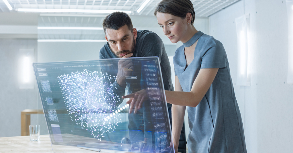 In the Near Future Male and Female Computer Engineers Talk While Working on the Transparent Display Computer. The screen shows an Interactive Neural Network, Artificial Intelligence Project, and Futuristic User Interface.