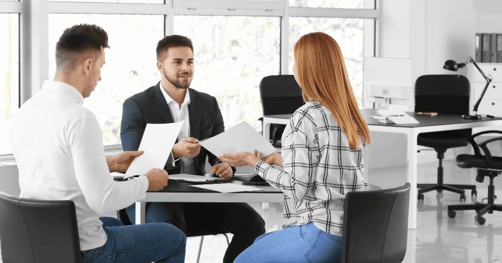 Digital marketing consultant presenting to client in office setting