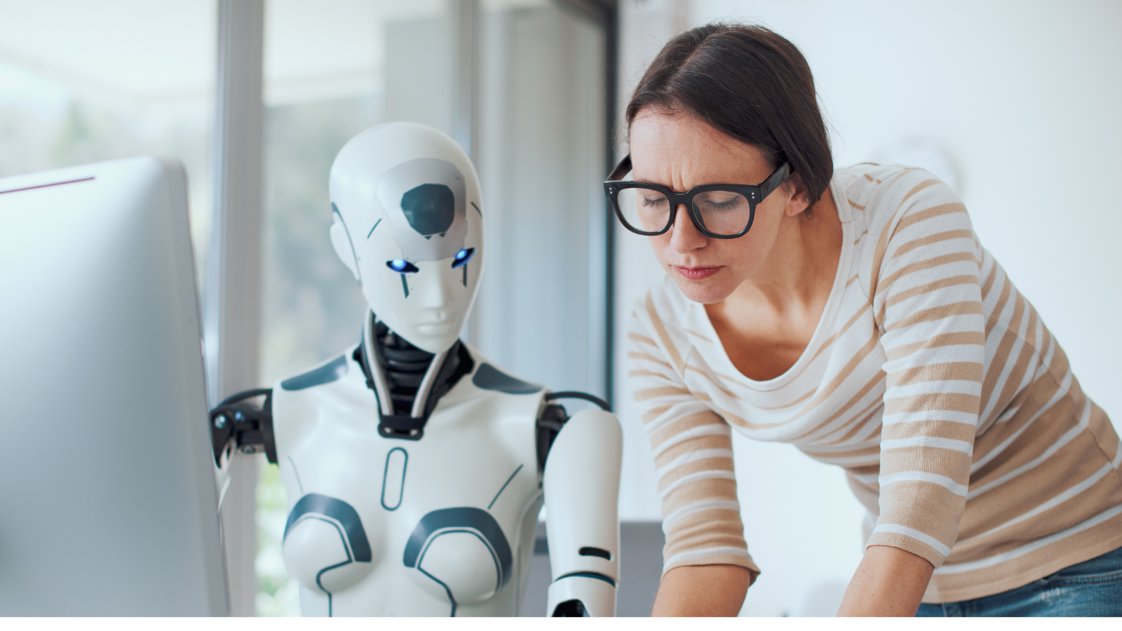 Image of a marketer collaborating with an AI assistant on a digital marketing campaign