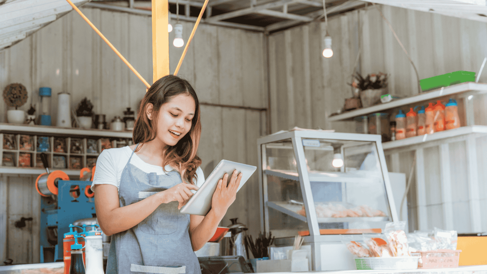 Woman Taking Online Order at Her Small Stall Shop