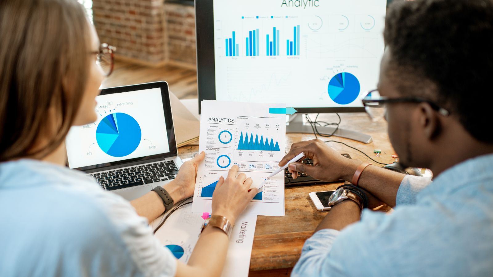 Digital marketer performing keyword analysis using SEO tools.