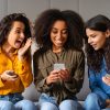 Mobile Marketing: Friends reacting to smartphone content, have home party