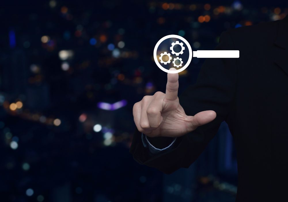 a person in a suit holding a magnifying glass with a cityscape in the background