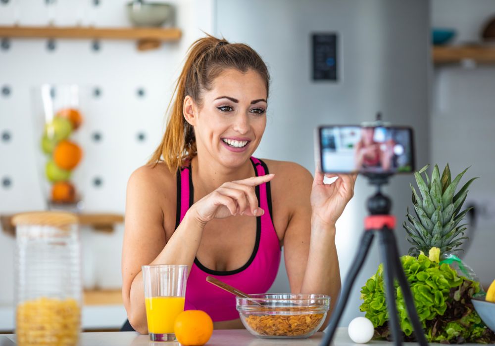 influencers becoming retailers: a person is taking a video of themselves eating breakfast