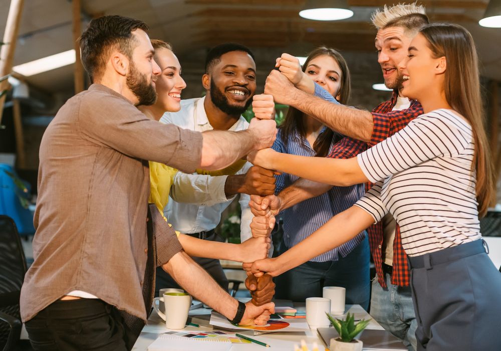 build a profitable business with small audience: a group of people working together in an office