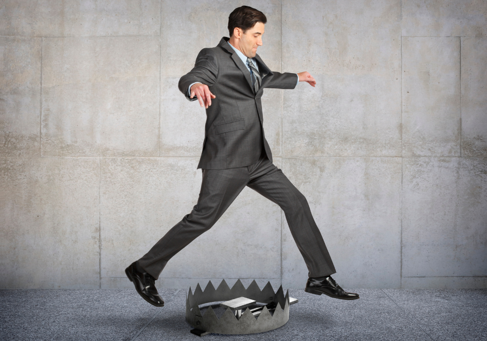 attention trap: Man avoiding a bear trap while walking.